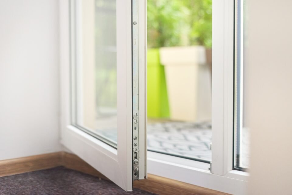 Open glass plastic white floor door to balcony terrace.